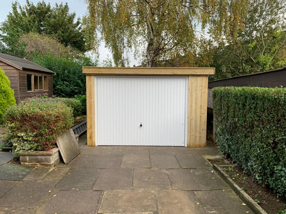 Updated Grimston Garage New Door and Timber Surround